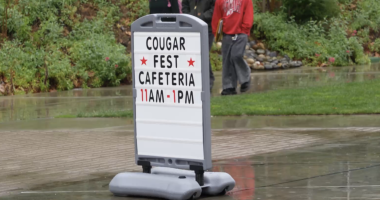 Sign advertising Cougar Fest in the rain on the College of the Canyons Campus